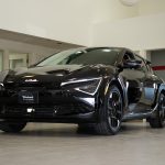 Black Kia EV6 sitting in modern show room