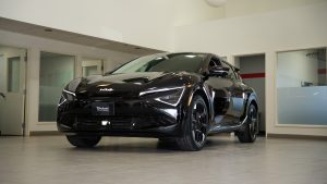 Black Kia EV6 sitting in modern show room