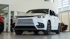 White 2025 Lexus TX 500h in showroom