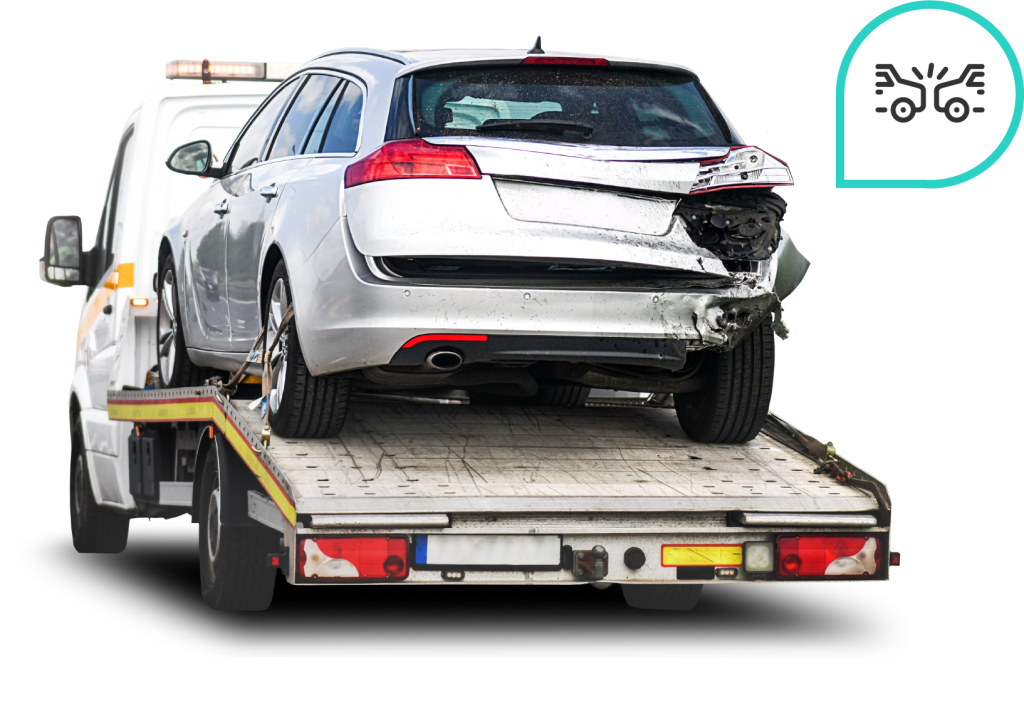 A silver wagon with rear-end damage being towed on a flatbed truck, next to a crash icon—highlighting trade-in options for damaged vehicles.