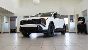 white 2026 kia Sportage sitting in bright showroom