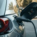 close up of ev charger plugged into vehicle