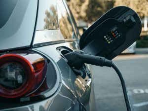close up of ev charger plugged into vehicle