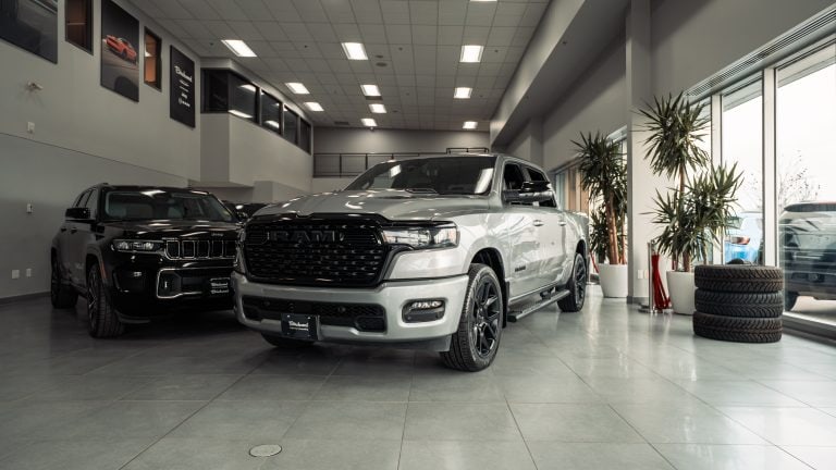 silver 2025 ram 1500 sport in show room