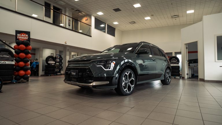 green 2026 kia Niro hybrid parked in showroom