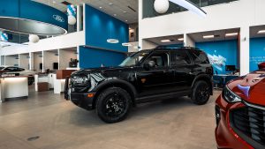 black 2025 ford bronco sport sitting inside ford dealership