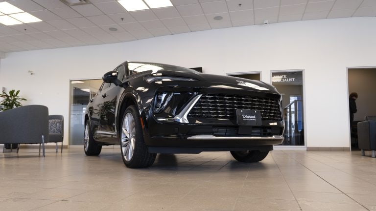 black 2026 buick envision parked in showroom