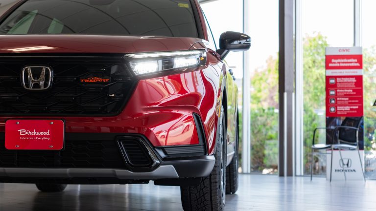 tight shot of red cr-v grille and headlight