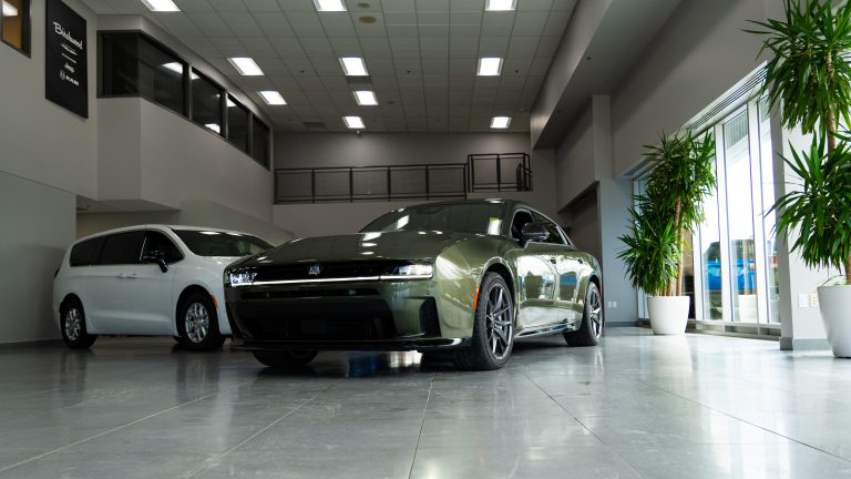 2026 green dodge charger parked in showroom