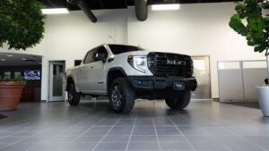 gmc sierra truck parked in showroom