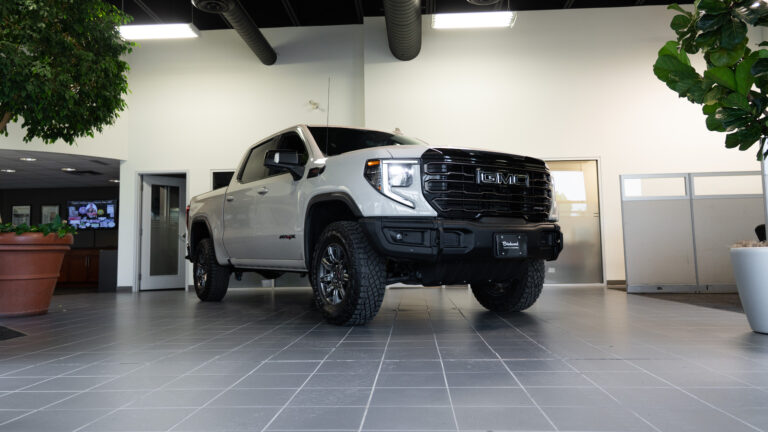 gmc sierra truck parked in showroom